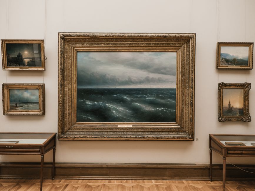 Elegant seascape painting in a classic art gallery with vintage frames.